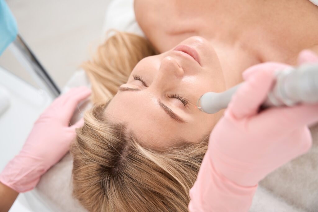 Female patient on laser skin resurfacing procedure